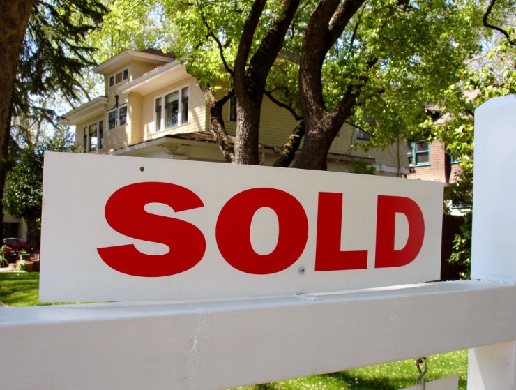 Sold sign in front of home