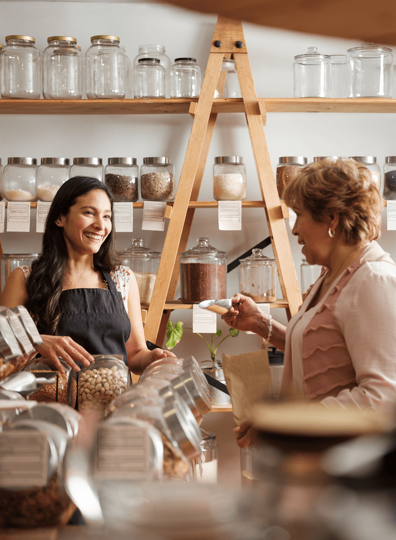 Retail store manager talking to customer